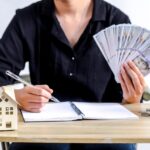 Financial Planning Scene With Hands Managing Money And Documents