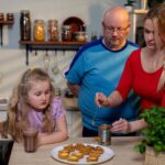 A lovely family enjoying baking together in a warm cozy kitchen setting filled with joy