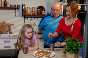A lovely family enjoying baking together in a warm cozy kitchen setting filled with joy